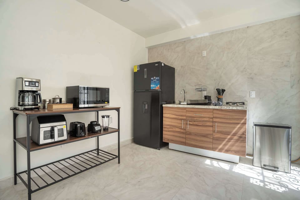 Prepare delicious meals in our fully equipped kitchen with a fridge and microwave.