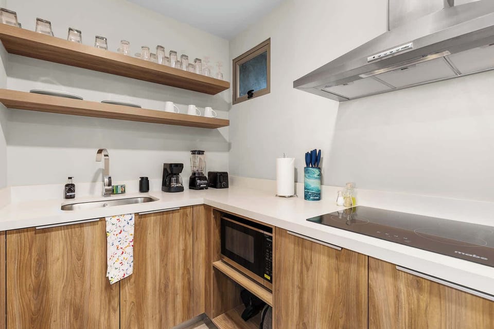 Sleek design meets functionality in this modern kitchen space.