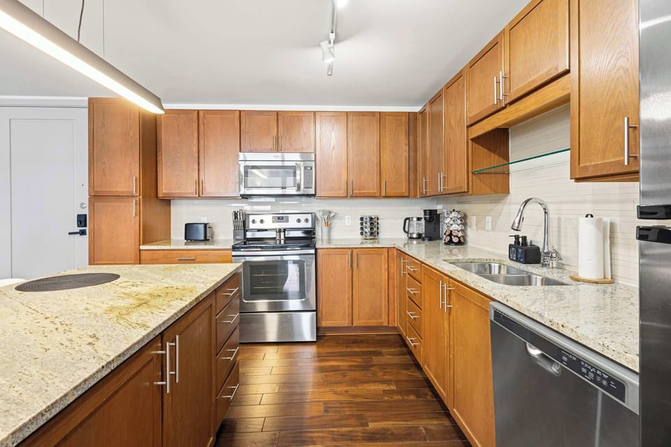 Cook comfortably in a fully equipped kitchen with modern appliances and generous counter space. Everything you need for quick meals or home cooked dinners is ready.