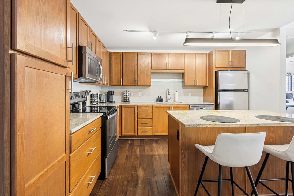 Fully equipped kitchen with ample counter space makes home cooking simple and enjoyable. Great for quick breakfasts or evening dinners in.