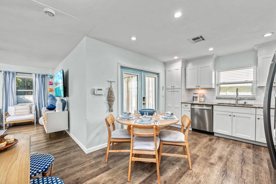 Step into a sleek, sunlit kitchen where stainless steel appliances, granite countertops, and thoughtful details make cooking feel effortless and fun.