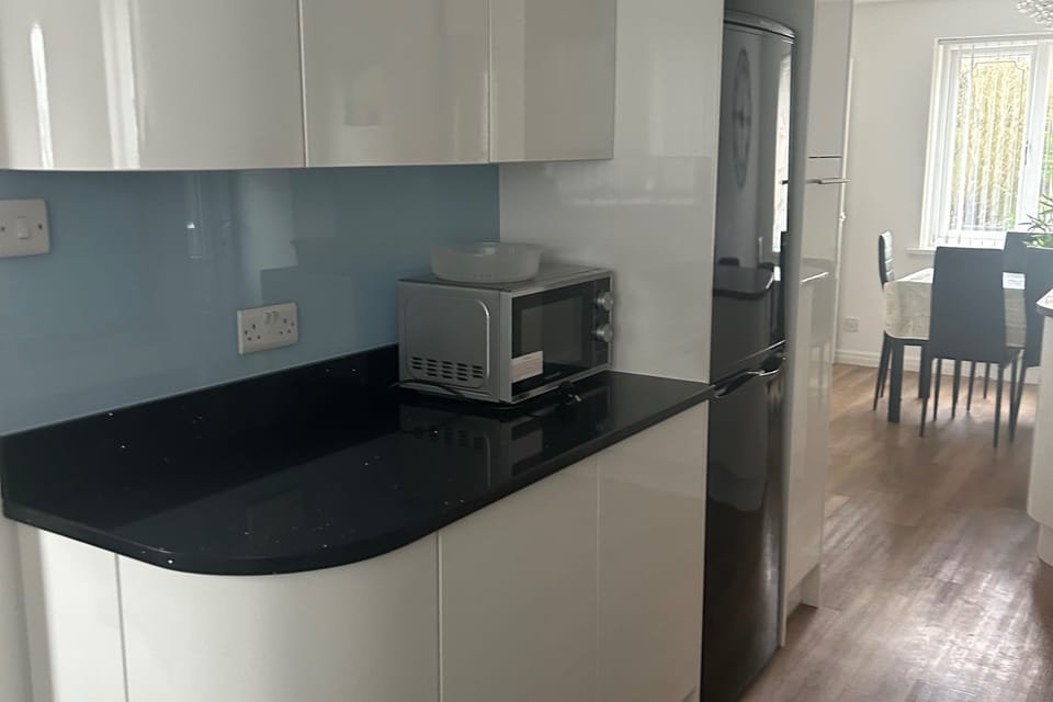 Kitchen with dishwasher, microwave and cooker, fridge freezer