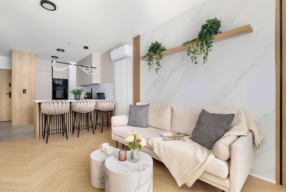 Open living space combining lounge and dining areas in a modern layout.