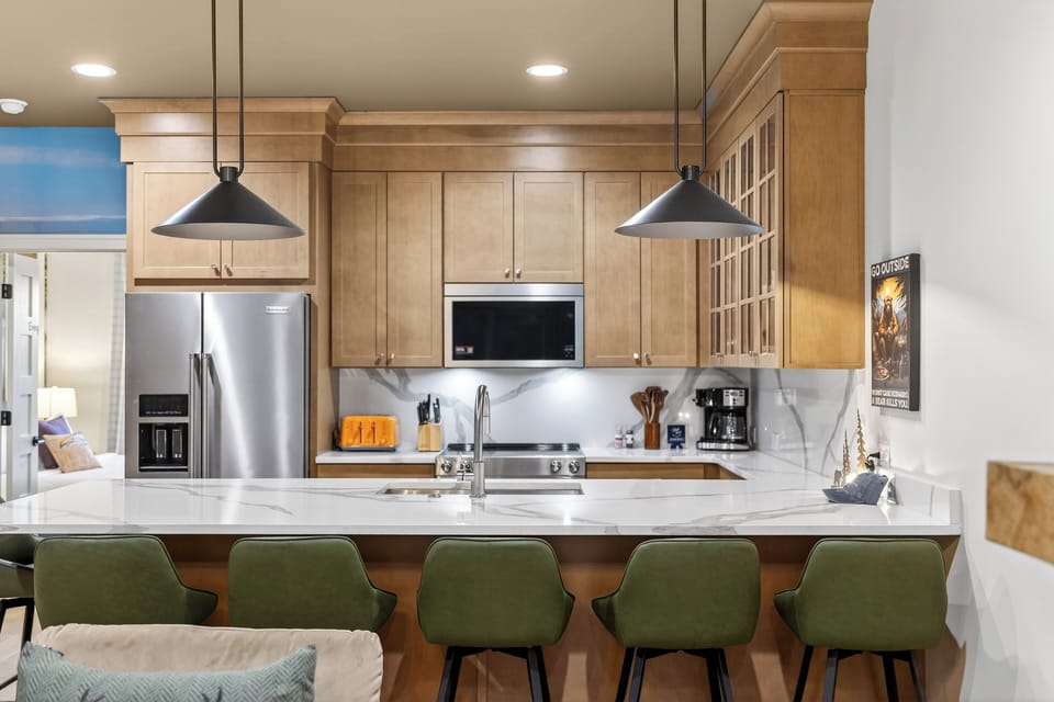 Fully equipped kitchen with a roomy island—grab a seat at the breakfast bar and keep the conversation going.