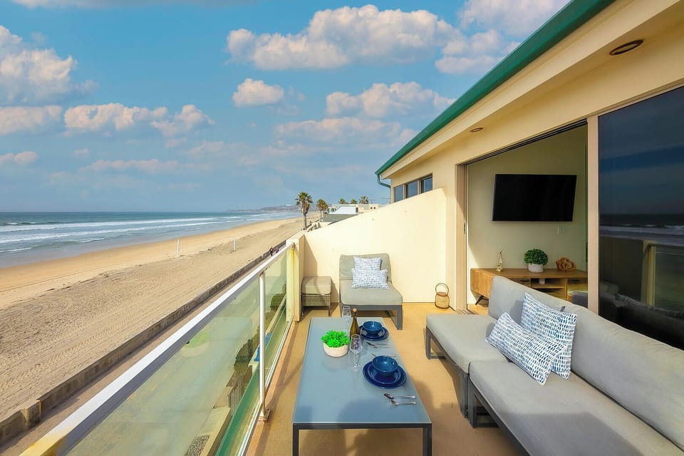 Spacious balcony featuring a comfortable lounge and dining area, perfect for relaxing, entertaining, and enjoying the outdoors.