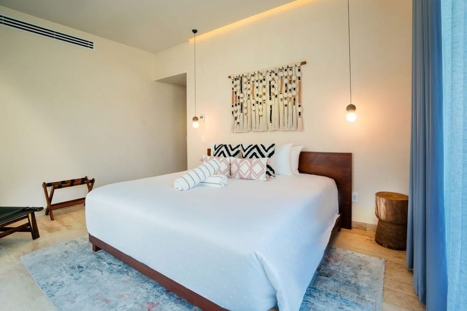 Unwind in crisp white linens and serene, airy calm.