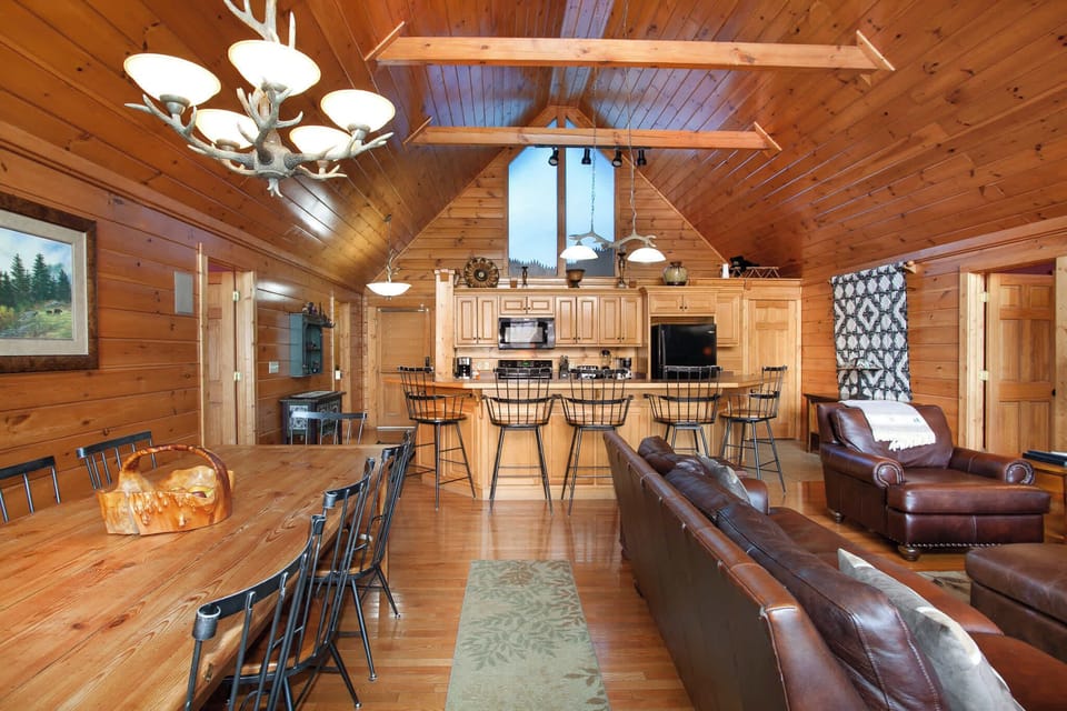 Gather for meals and movies in this bright, open-concept living and dining area.