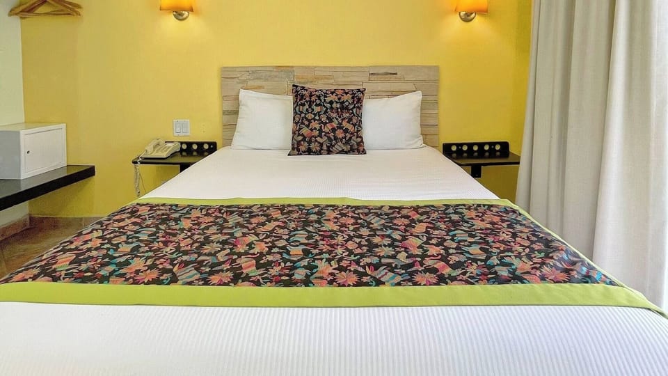 Wake up to sunshine and breezy balcony-side comfort daily.