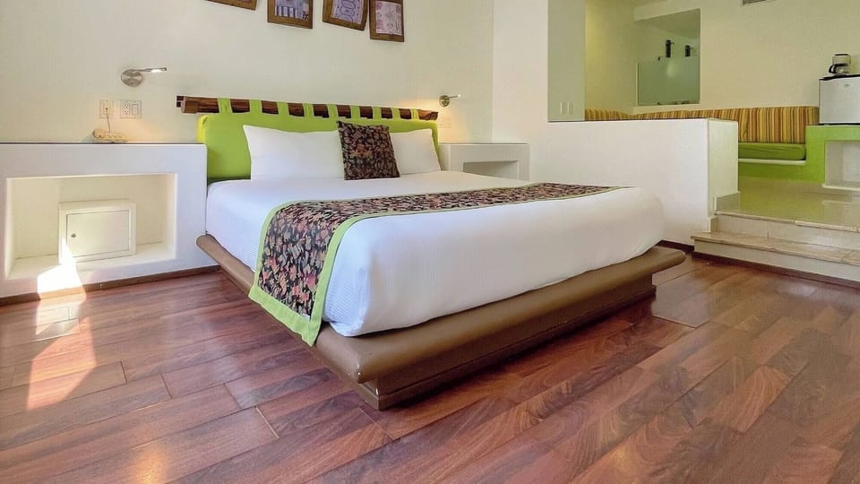Unwind in a sunlit king bed with stylish built-ins.
