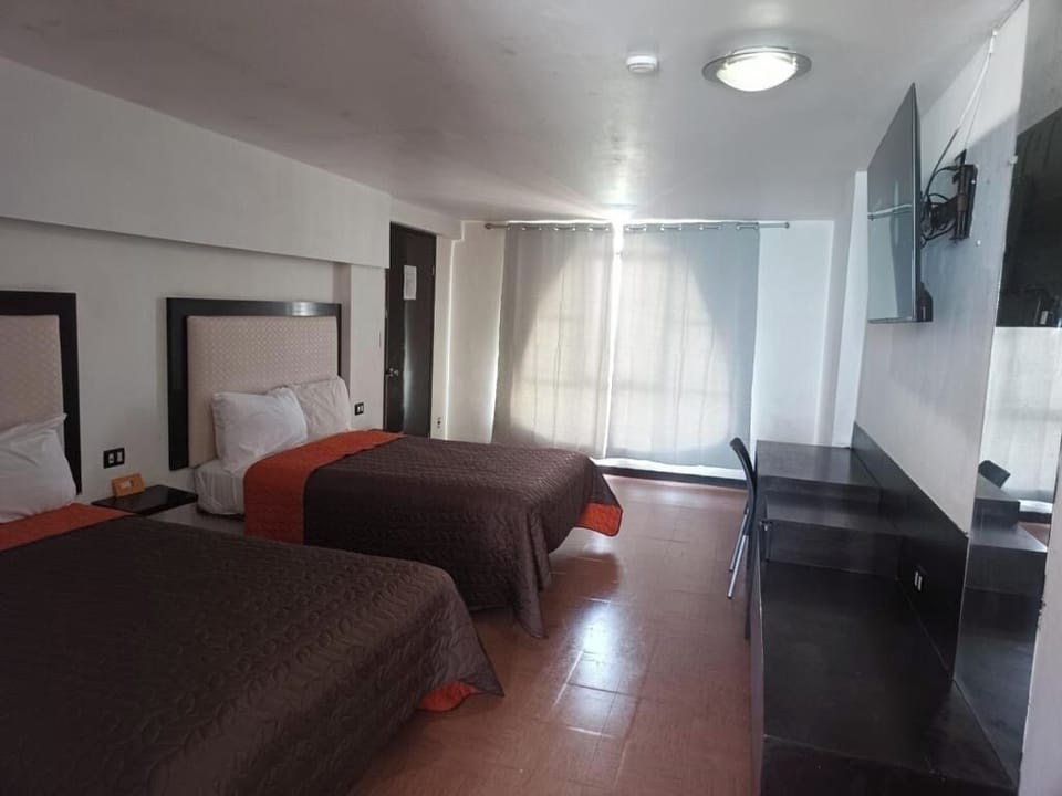Relax in a spacious twin-room layout with easy movement.