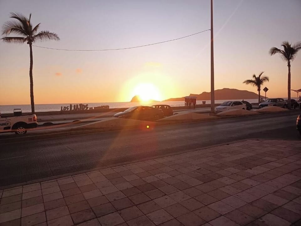Unwind at sunset as the shoreline glows in gold.