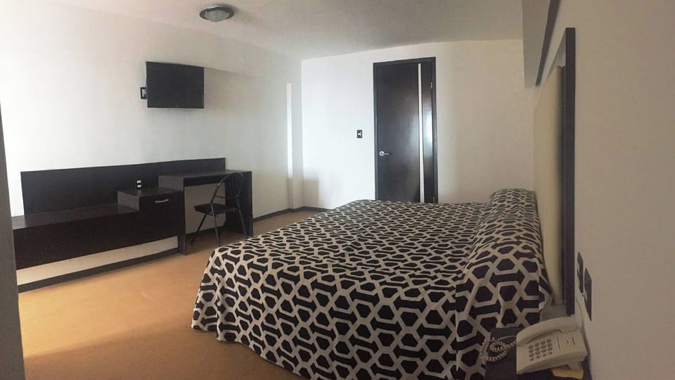 Stretch out comfortably with extra space and in-room workspace.