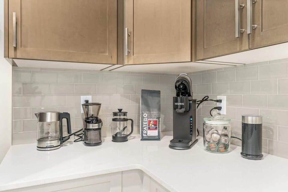 Fully stocked coffee bar with Keurig, French Press, Grinder, Locally roasted whole bean coffee. 