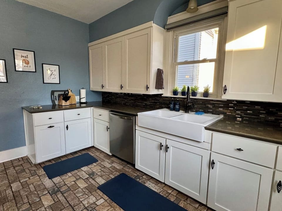 You'll find plenty of dishes, silverware, coffee cups, glasses, wine glasses and more for your group.