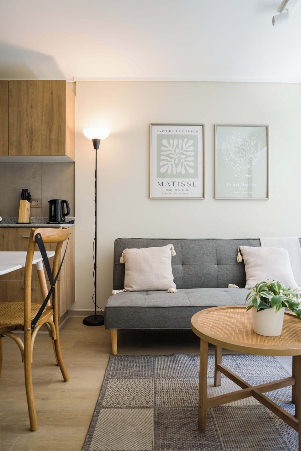 Charming living space with stylish decor and cozy seating, perfect for relaxation in this modern studio apartment.