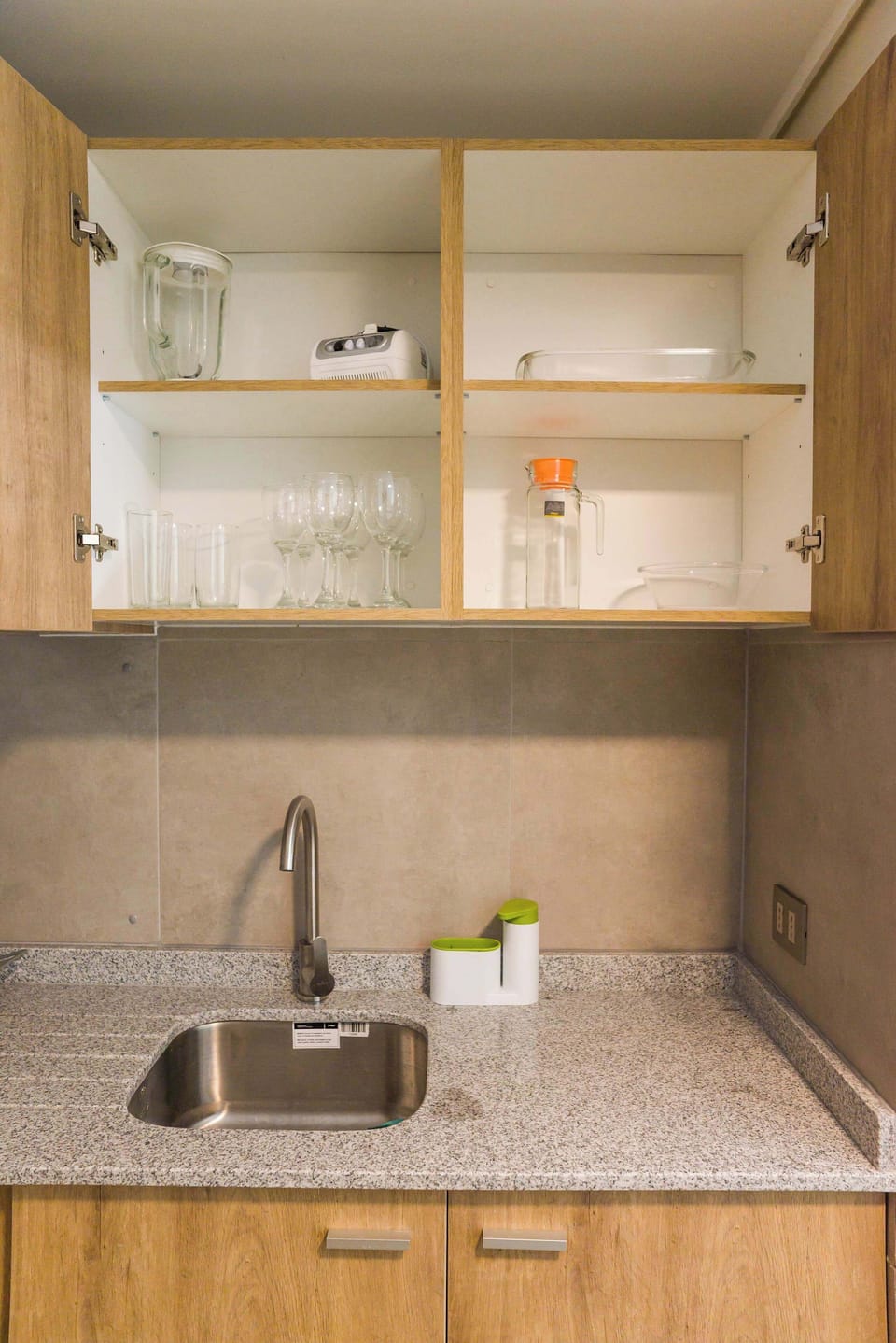 Well-equipped kitchen with modern amenities and ample storage, perfect for preparing meals during your stay.