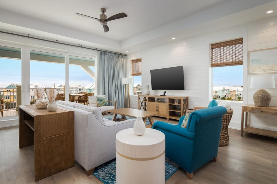 With sweeping views of the coastline, this inviting living space blends elegant furnishings with airy coastal vibes.