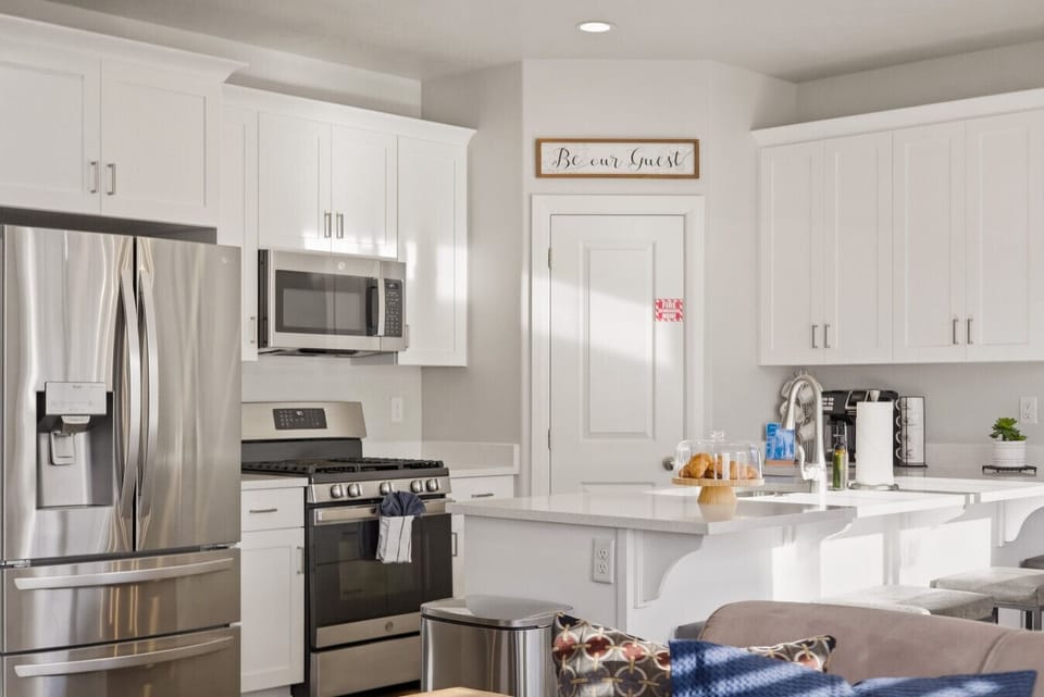 Kitchen: Modern appliances & bright decor invite culinary adventures and delightful gatherings!