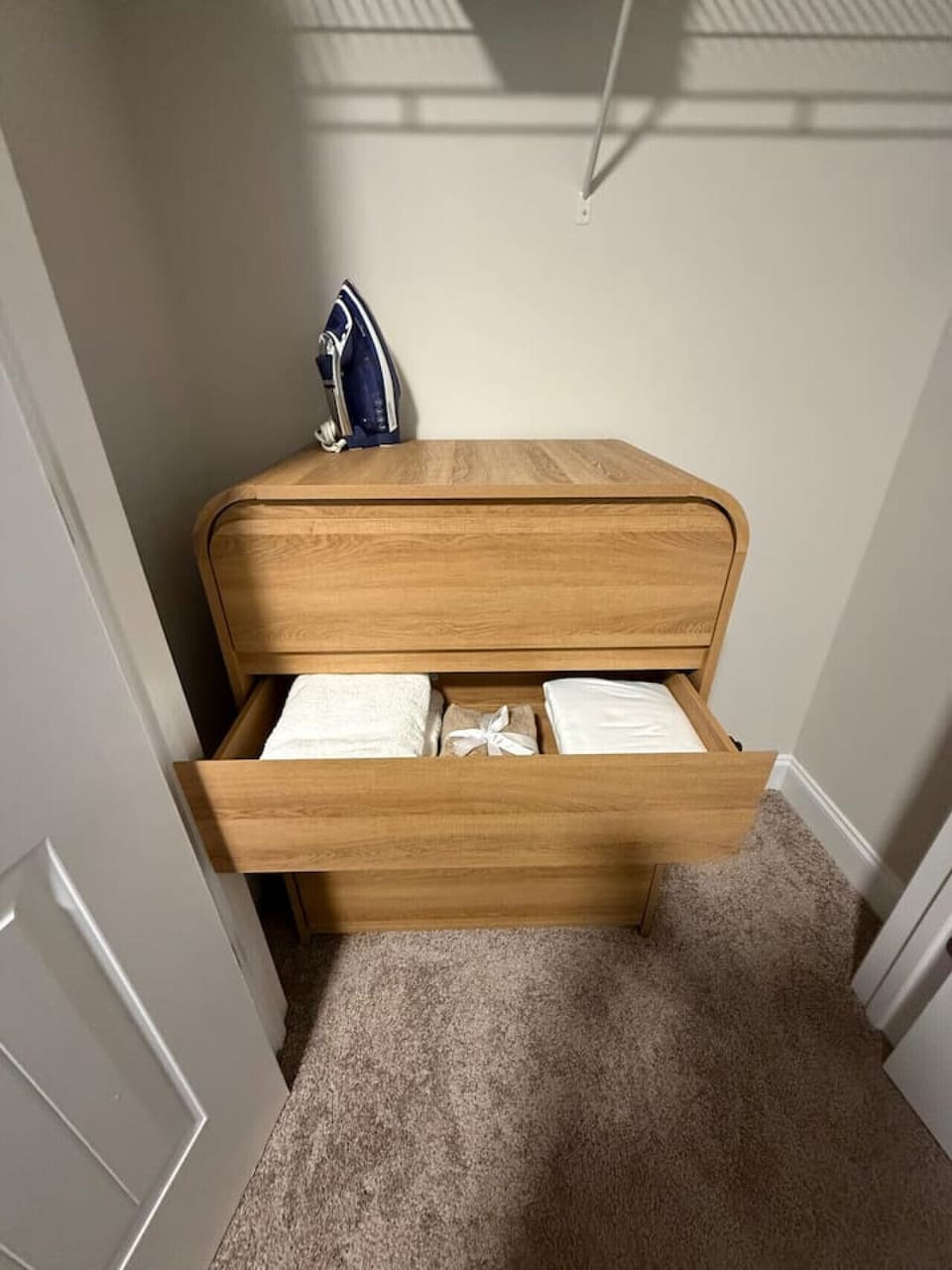 `Find everything you need for a comfortable stay with fresh linens and laundry essentials tucked away in our modern wood dresser.