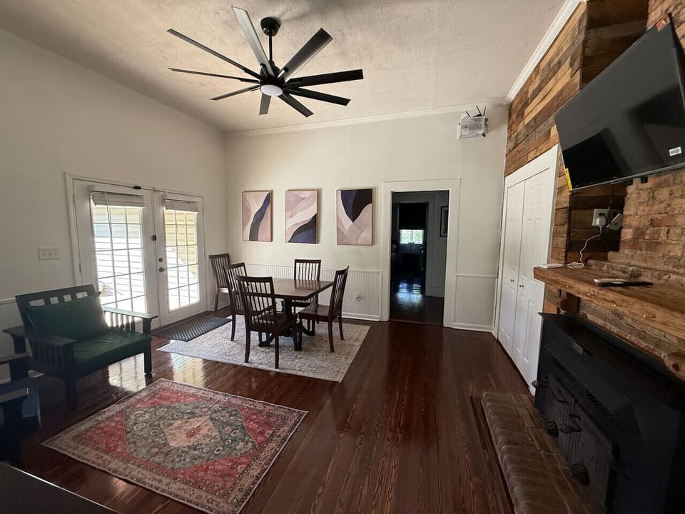 You’ll love the dining area for four with French doors leading to a large deck and big fenced backyard—ideal for gathering and relaxing.