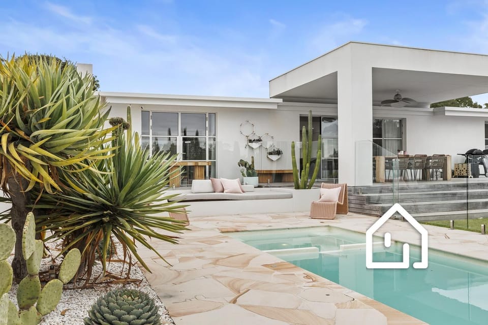 A deluxe Palm Springs inspired coastal haven designed for relaxed family escapes