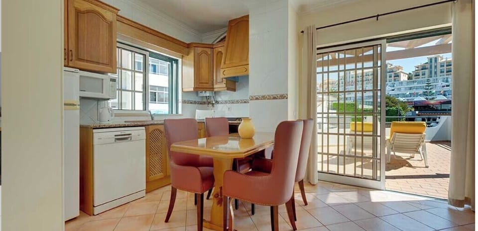 Start mornings with breakfast by the balcony’s warm light.