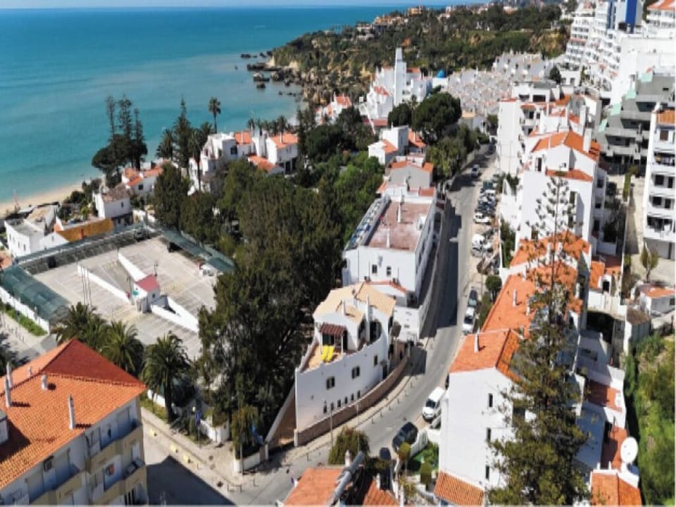 Arrive to a charming coastal villa perched above the street