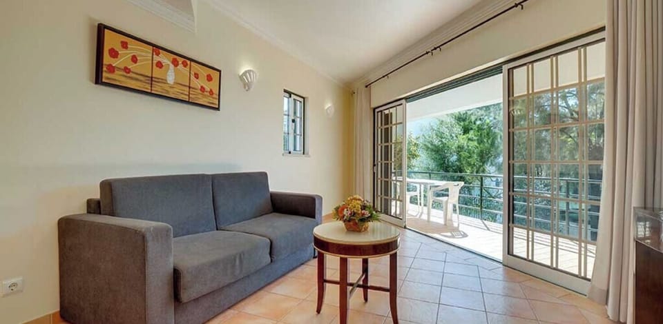Lounge on the sofa, then slide doors open to the terrace.