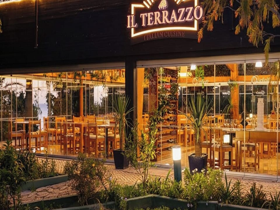 Dine al fresco vibes with warm lighting and Italian flavors.