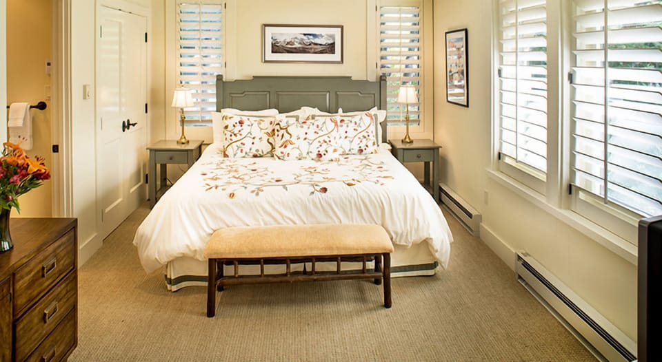 Drift off beneath crisp linens and bright, shuttered window light.