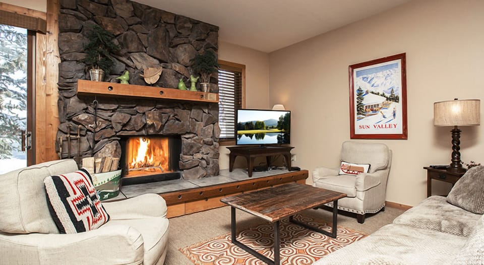 Unwind by the roaring stone fireplace after snowy adventures.