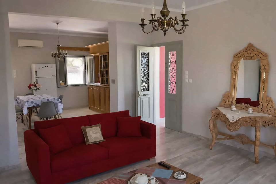 Cozy living room with a vibrant sofa and plenty of natural light to unwind