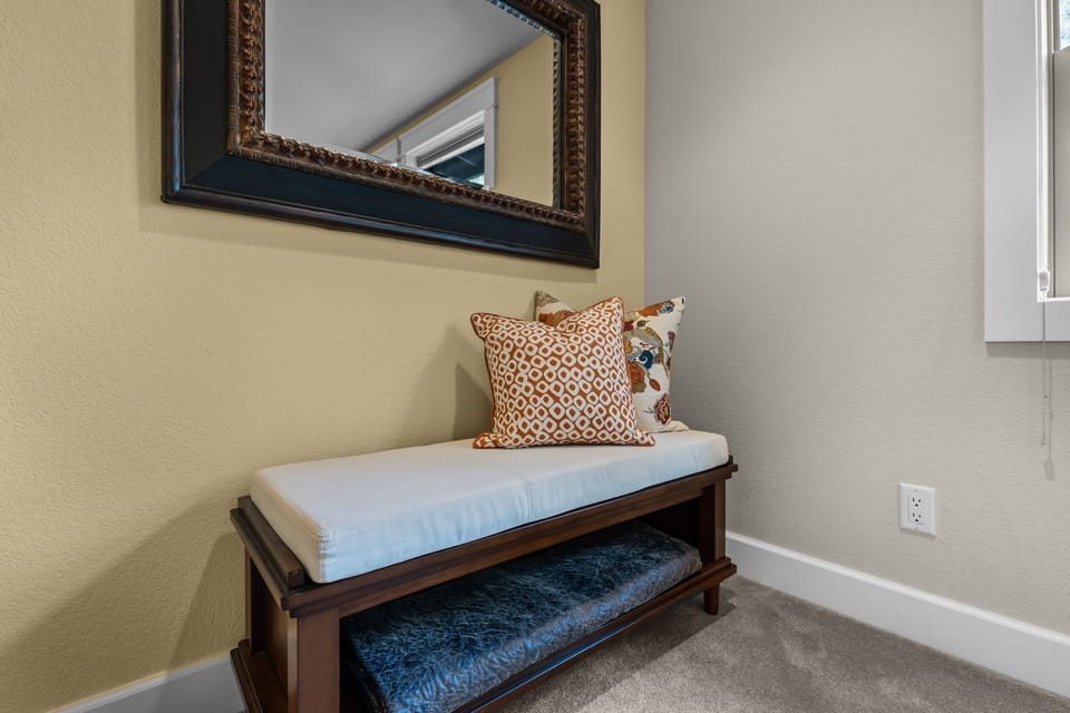 Cozy reading nook with elegant bench seating and stylish pillows - your perfect spot for morning coffee or evening relaxation.