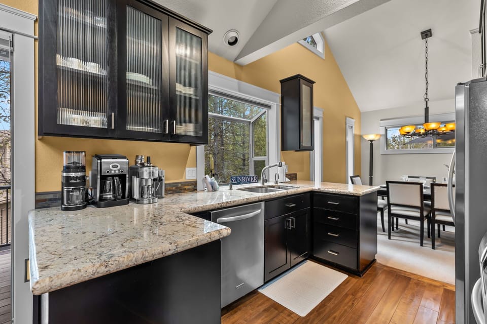 Your gourmet kitchen awaits with granite counters, stainless appliances, and a coffee station for morning brewing rituals.