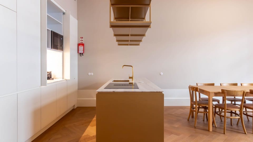 A sleek kitchen with a statement island — perfect for cooking, gathering and sharing moments.

#LovelyStay #InteriorDesign #PortoPortugal #ModernLiving