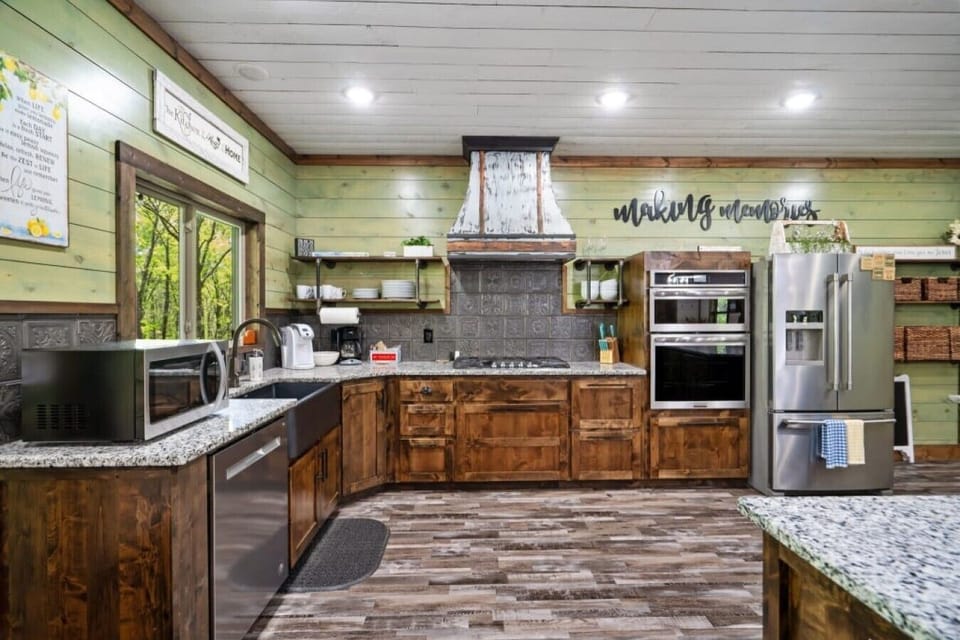 Kitchen | Rustic Wood Cabinets | Stainless Steel Appliances & Farmhouse Sink