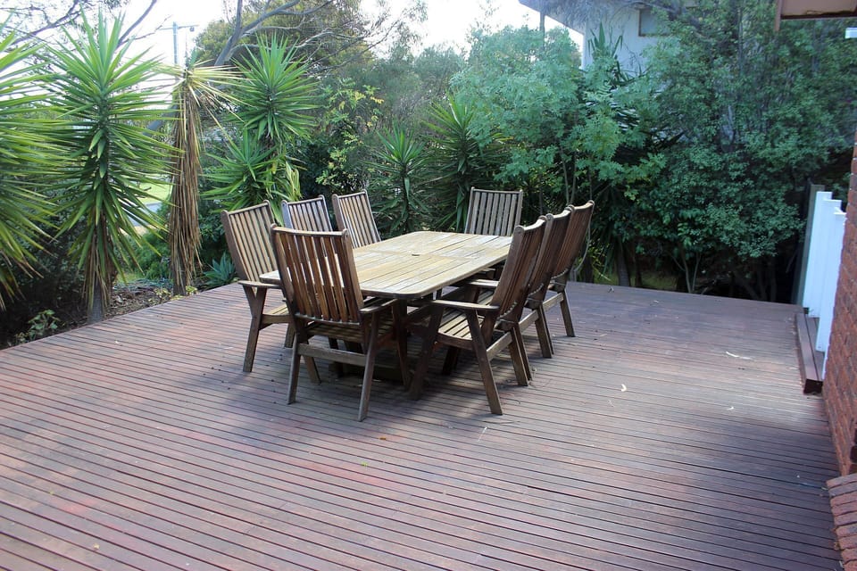 Front balcony with outdoor table & chairs and this is the front entrance.