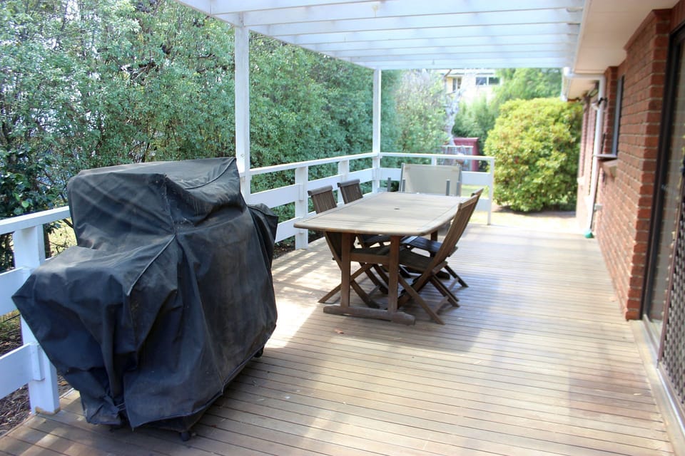Outdoor area with BBQ and outdoor table & chairs plus outdoor lounge chairs