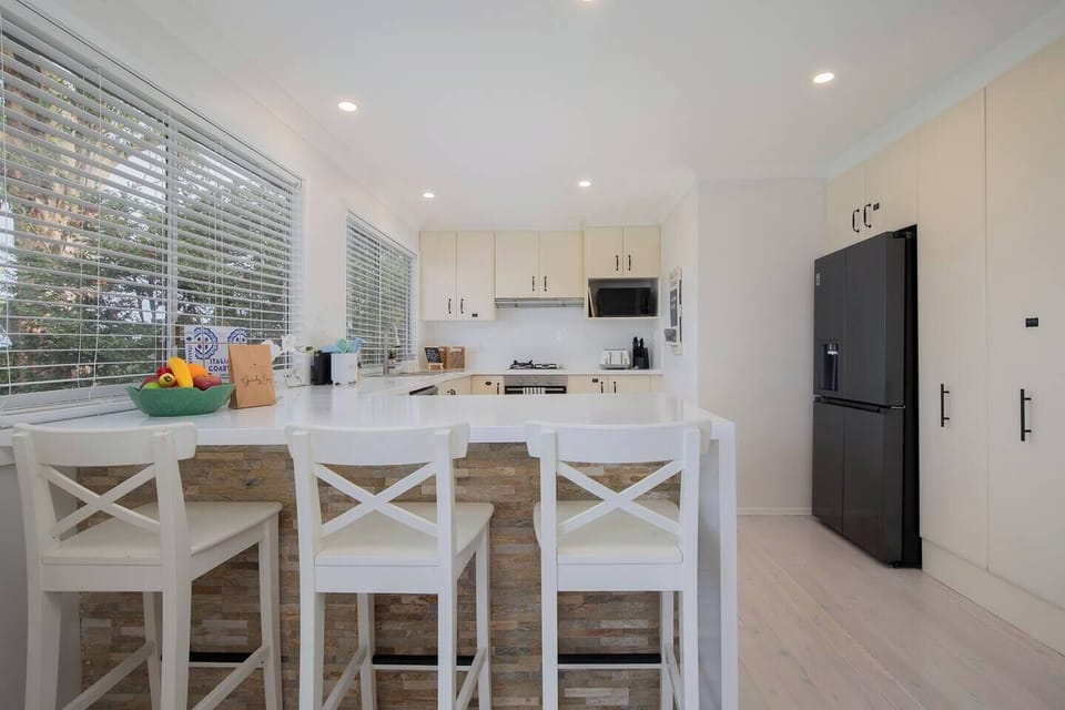 Start your morning at the breakfast bar with coffee and conversation before heading out to explore Wamberal Beach.