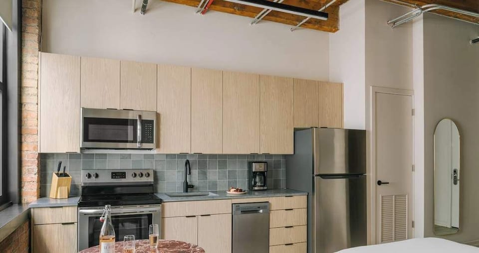 Fully equipped kitchen with stainless steel appliances and ample cabinet space