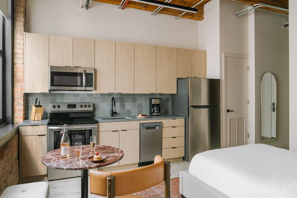 Fully equipped kitchen with stainless steel appliances and full size refrigerator