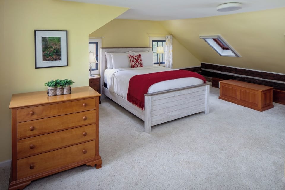 Settle in for restful nights in an airy upstairs haven.