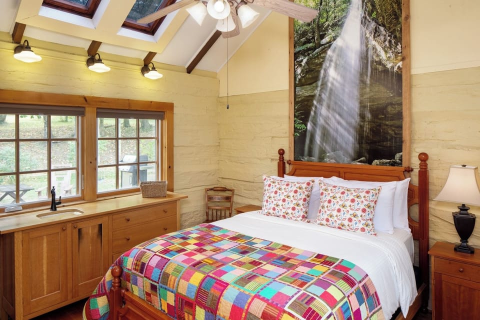 Escape to a cozy loft room beneath sunlit skylights.