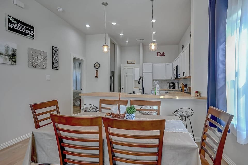 Everyone can enjoy hanging out close to the living room at the dining room table right next to the kitchen!