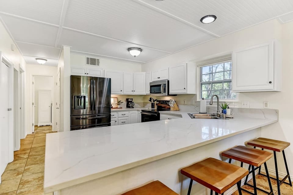 Beautifully updated kitchens with Bianca Romano granite countertops