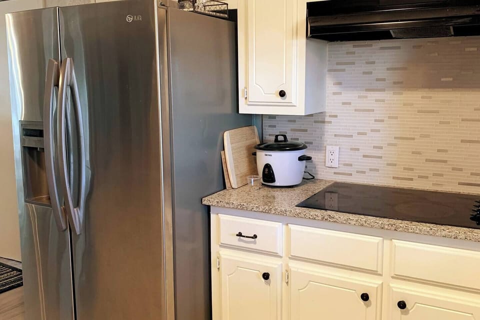 Kitchen has updated appliances and granite countertops.