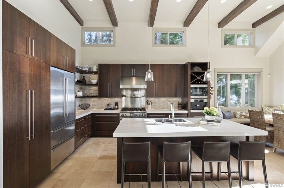 Spacious, contemporary kitchen featuring premium appliances and plenty of counter space for meal prep.