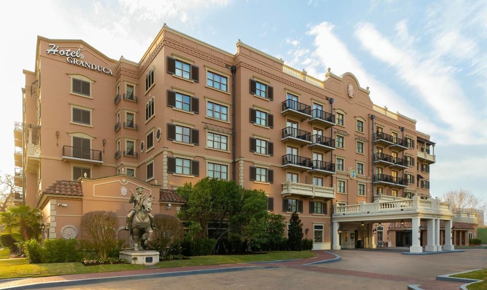Arrive in style to a grand, resort-like hotel exterior.
