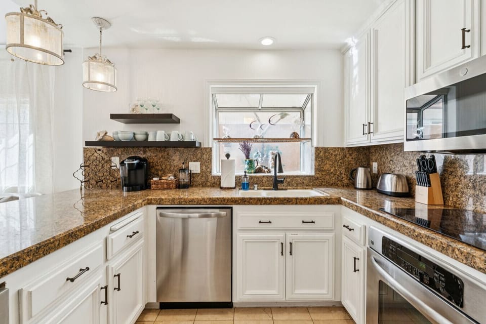 Modern kitchen with stainless appliances and plenty of prep space.