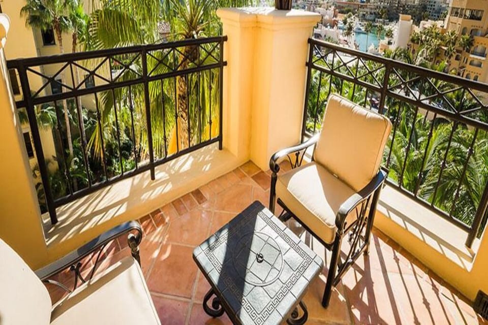 Sip morning coffee on the sunlit balcony overlooking the marina.